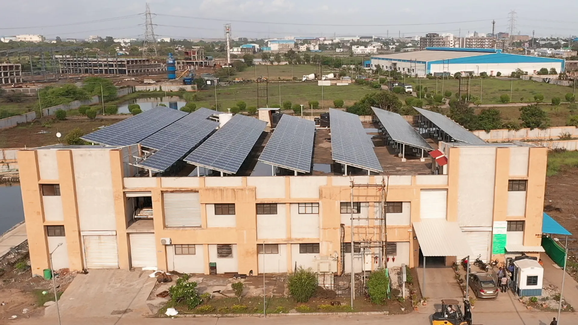 Rooftop solar installation at Marudhar Spinning Mills Pvt. Ltd with a wide industrial setting.